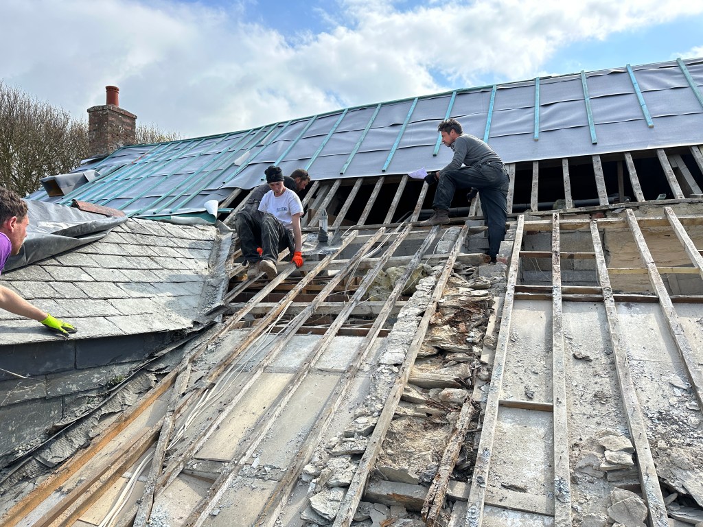 Old timber beams on an exposed area of roof